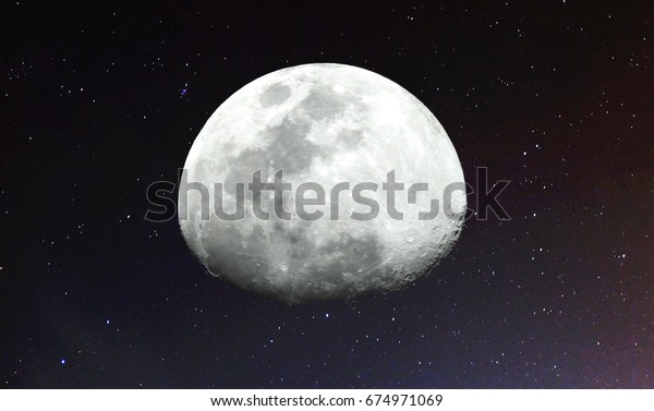 Moon\
and stars / The Moon is an astronomical body that orbits planet\
Earth, being Earth\'s only permanent natural satellite. It is the\
fifth-largest natural satellite in the Solar\
System