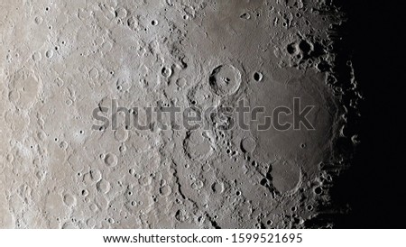 Moon surface close up. Craters and furrows on the surface of the earth's satellite. (Elements of this image furnished by NASA)