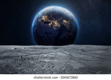 Moon surface and Earth at night in deep space. Planet and satellite. Artemis space program. Elements of this image furnished by NASA