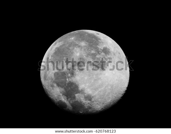 Moon Surface as wallpaper / The Moon is an\
astronomical body that orbits planet Earth, being Earth\'s only\
permanent natural satellite. It is the fifth-largest natural\
satellite in the Solar\
System