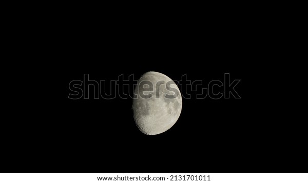 The moon view with the bright moonlight and moon\
surface at night