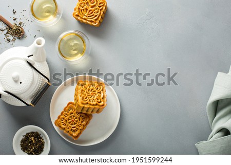 Mooncakes served with tea for the Chinese mid Autumn festival overhead shot