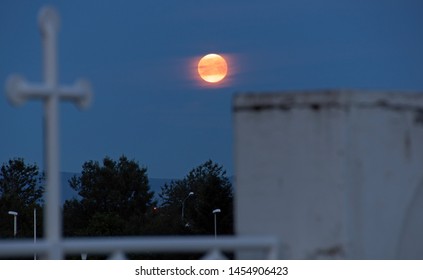 A Moonlight Night Over Cemetary Gate In Akranes Iceland