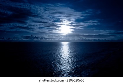 Moonlight In Ocean Landscape. Bright Full Moon Over The Sea