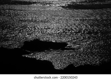 Moonlight Reflecting On Tranquil Pacific Ocean Water At Night