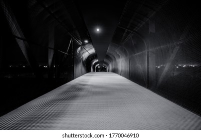 Moonlit bridge with chain link fence - Powered by Shutterstock