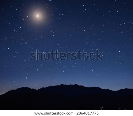 The moonlit night sky was adorned with a mesmerizing display of twinkling stars, creating a truly enchanting and captivating scene. The soft glow of the moon cast a gentle radiance upon the celestial.