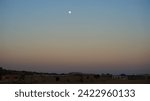 Moonrise over a rural village