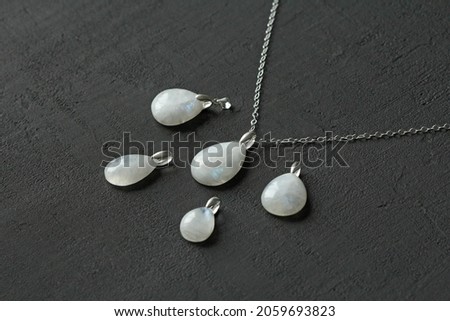 Moonstone, adularia natural pendants, necklace drop shape. Short necklace of Moonstone. Handmade jewelry made from natural stones. Modern Author's jewelry. Natural Moonstone pendants on silver chain. Imagine de stoc © 