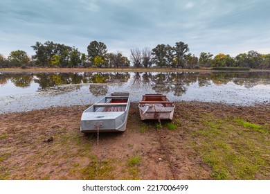 Moored Boats On A Lake Shore On A Cloudy Morning