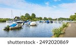 Moored boats on the River Stour at Christchurch Town Quay, Dorset