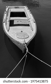 Moored Old Wooden Oar Boat. Black And White Photography