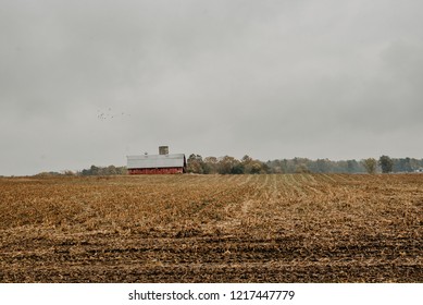Mooresville IN USA 10 26 2018: A red barn located in a cornfield off a Indiana country road. 
