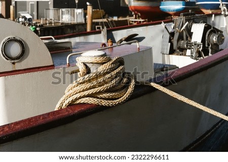 Mooring rope and bollard at the harbor. Marine rope