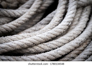 Mooring Rope Old Frayed Boat Then Piled On The Floor.  Ship Or Rock Climbing Tackle.