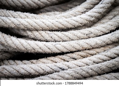 Mooring Rope Old Frayed Boat Then Piled On The Floor.  Ship Or Rock Climbing Tackle.