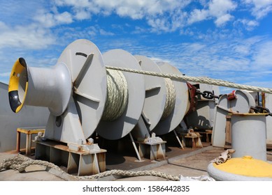 Mooring Winch, Mooring Windlass With Anchor Rope In Line Bundle On Winch Holding Strain The Ship Attract Safety To The Port Wharf Terminal, Safety Equipment Along Side The Ship To The Port Wharf