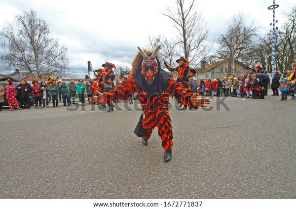 Moosburg, Germany - Februar 25, 2020: people in funny\
costumes of trees, pirates or devil have great time during annual\
carnival parade in oldest town between Regensburg and Italy. Funny\
tradition. 