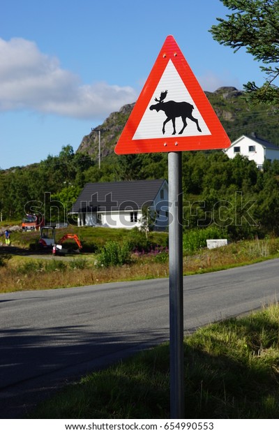 Moose crossing road sign in\
Norway