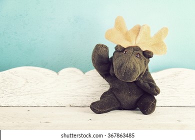 Moose Deer toy waving hello, Say Hi, Hello.