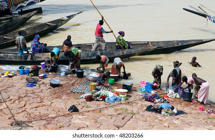 MOPTI - AUGUST 16: Women washing in the river, the lack of resources means that the population use the Niger river for washing and grooming, August 16, 2009 in Mopti, Mali