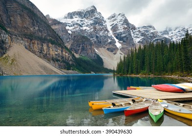 Moraine Lake And Boat With Snow Capped Mountain Of Banff National Park In Canada