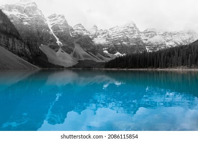 Moraine Lake, On A Foggy Winter Day With Clear Water And Mountain Ps Behind