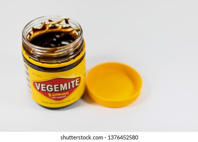 Morayfield, Queensland/Australia - April 19 2019: A top down view of an opened jar of Vegemite isolated on a white background
