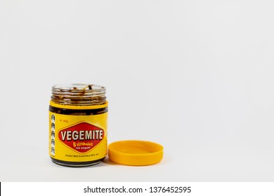 Morayfield, Queensland/Australia - April 19 2019: An opened jar of vegemite isolated on a white background