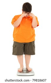 Morbidly obese fat child on scale crying. Weight loss Concept.