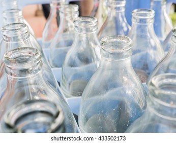 more empty bottle in crates