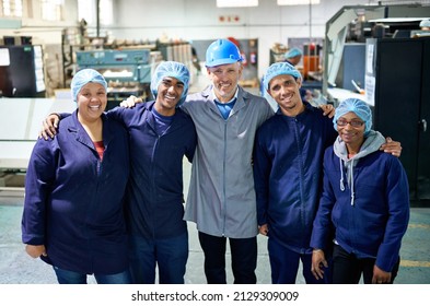 More Than Employees... Portrait Of A People Working Inside A Printing, Packaging And Distribution Factory.