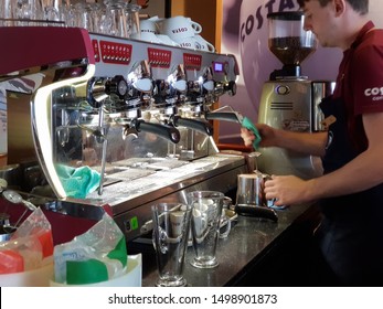 Morecambe Lancashire England UK. 09/07/2019 A Costa Coffee Barista Working A Coffee Machine.