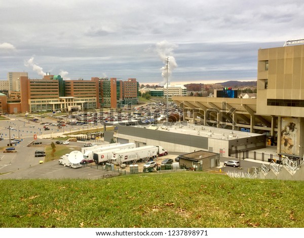 Morgantown, West Virginia - November 22, 2018:\
Broadcast production crews prepare for the televised West Virginia\
University-University of Oklahoma football game outside WVU’s\
Mountaineer Field.