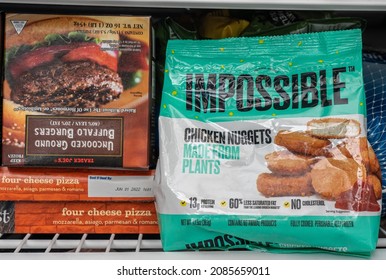 MORGANTOWN, WV - 4 November 2021: Packaging For Impossible Foods Chicken Nuggets Inside Domestic Freezer Alongside Buffalo Burgers