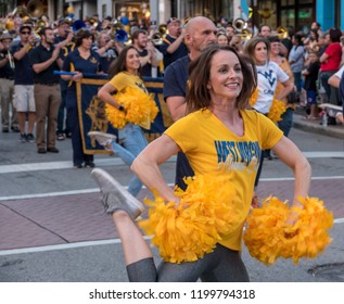 MORGANTOWN, WV - 5 OCTOBER 2018: Homecoming Parade Down Main Street Of Morgantown With Alumni Cheer Leaders