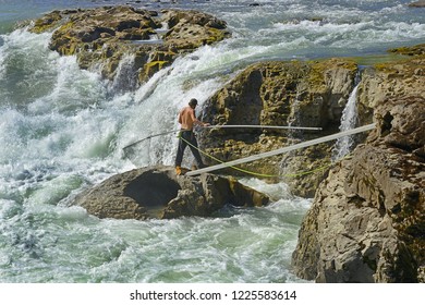 MORICETOWN, BC, CANADA – AUGUST 18, 2018: Wet'suwet'en Fishing Site On Bulkley River At Moricetown Canyon. Instead Of Traditional Fishing With A Hook Or Landing Net For The Wet'suwet'en First Nation