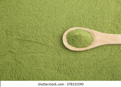 Moringa powder with wooden spoon