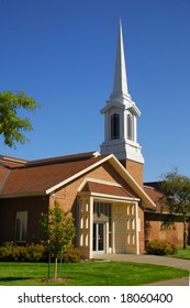 A Mormon Church With Tall Steeple.