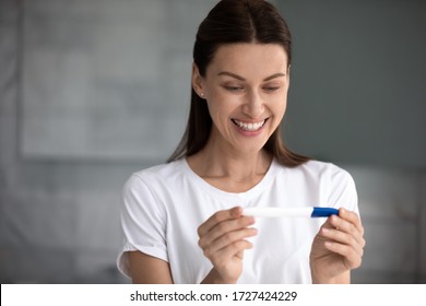 In Morning 35s Woman Holding Pregnancy Test Saw Two Stripes Feels Happy And Satisfied By Positive Result. Long-awaited Planned Pregnancy Has Come, Check Ovulation Period, Fertility Maternity Concept