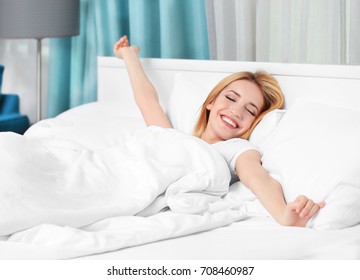 Morning of beautiful young woman in hotel room - Shutterstock ID 708460987