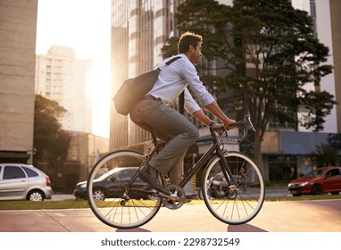 Morning, bicycle and business man in city for moving, commute and carbon neutral transportation. Travel, sustainability and cycling with male employee in urban town for journey, energy and transit - Powered by Shutterstock