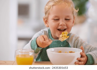 Morning, breakfast and cereal with child or table, Happy girl and home eating for nutrition. Energy and glass with orange juice for vitamins, fibre for toddler and healthy development for growing kid - Powered by Shutterstock