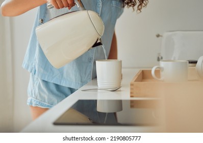 Morning, breakfast coffee and female hands pouring water in cup from retro kettle in kitchen at home. Woman in pajamas brewing tea or making a beverage on counter to start the day. - Powered by Shutterstock