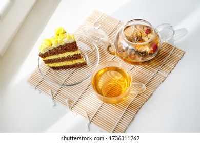 Morning Breakfast With A Cup Of Tea And Cake. A Summer Morning Tea In The Garden Made Up Of Lemon Drizzle Cake And English Breakfast Tea From A Pot.