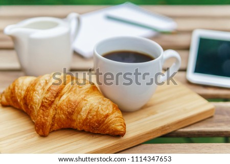 Similar – Image, Stock Photo Morning Breakfast In Green Garden With French Croissant, Coffee Cup, Orange Juice, Tablet and Notes Book On Wooden Table