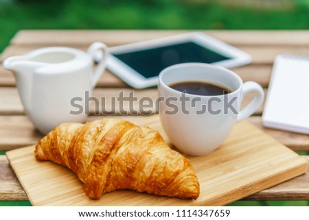 Similar – Image, Stock Photo Morning Breakfast In Green Garden With French Croissant, Coffee Cup, Orange Juice, Tablet and Notes Book On Wooden Table