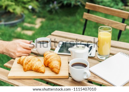 Similar – Image, Stock Photo Morning Breakfast In Green Garden With French Croissant, Coffee Cup, Orange Juice, Tablet and Notes Book On Wooden Table