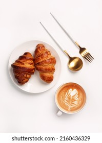 Morning breakfast setup. Croissant with coffee cup on white background. - Shutterstock ID 2160436329