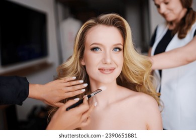 Morning of the bride. Make-up and hair styling for the bride on the wedding day. services of beauty professionals. - Powered by Shutterstock